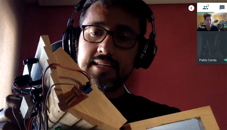 Pablo showing wooden turtle house on Google Hangout
