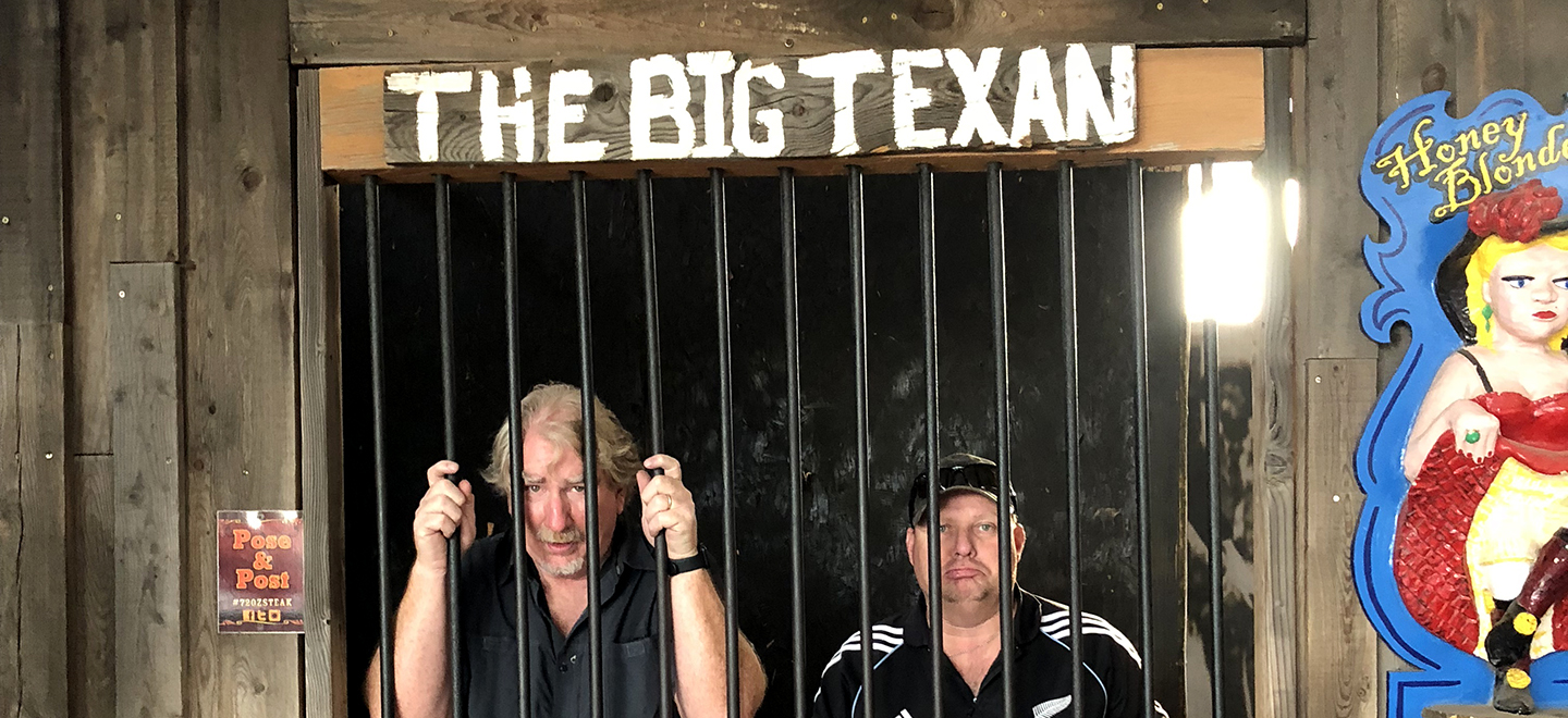 Greg and Brett standing in the "jail" at The Big Texan restaurant.